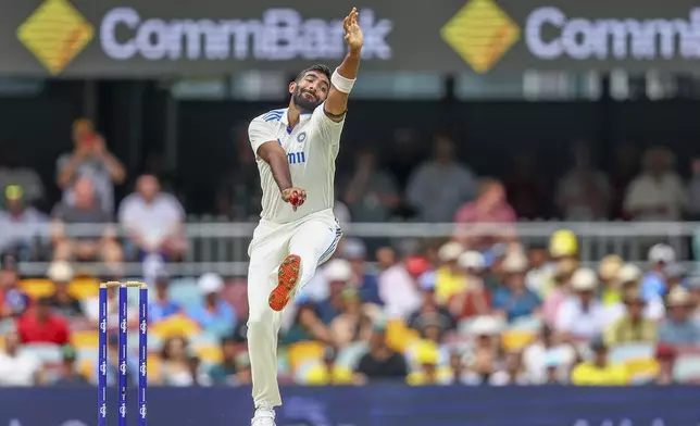 India's Jasprit Bumrah bowls a delivery during play on day one of the third cricket test between India and Australia at the Gabba in Brisbane, Australia, Saturday, Dec. 14, 2024. (AP Photo/Pat Hoelscher)