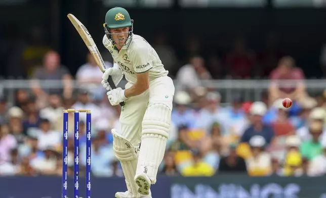 Australia's Nathan McSweeney bats during play on day one of the third cricket test between India and Australia at the Gabba in Brisbane, Australia, Saturday, Dec. 14, 2024. (AP Photo/Pat Hoelscher)