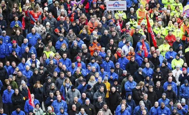 Volkswagen workers attend at a rally during at nationwide warning Volkswagen workers' strike, on the grounds of the main Volkswagen plant in Wolfsburg, Germany, Monday, Dec. 2, 2024. (Julian Stratenschulte/Pool Photo via AP)