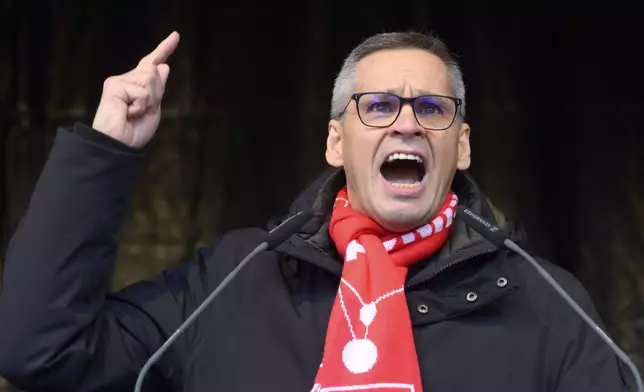 Thorsten Gröger, District Manager of IG Metall union, speaks at a rally during at nationwide warning Volkswagen workers' strike, on the grounds of the main Volkswagen plant in Wolfsburg, Germany, Monday, Dec. 2, 2024. (Julian Stratenschulte/Pool Photo via AP)