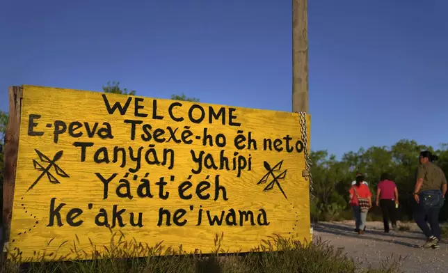 A welcome sign written in several different Native American languages at the entrance to the Indigenous Peyote Conservation Initiative homesite, led by several leaders within the Native American Church, in Hebbronville, Texas, Sunday, March 24, 2024. (AP Photo/Jessie Wardarski)