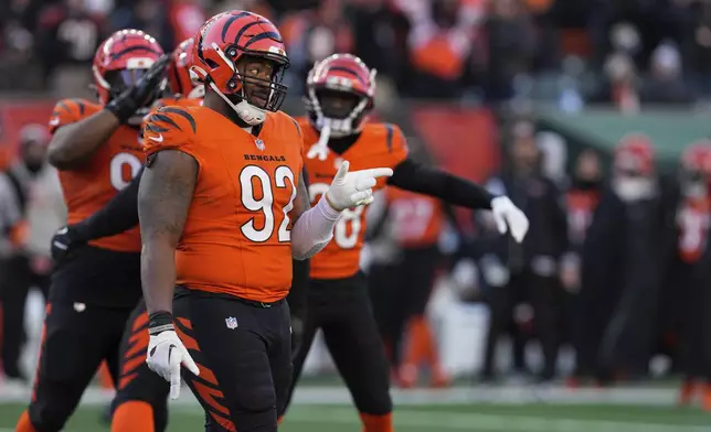 Cincinnati Bengals defensive tackle B.J. Hill (92) reacts after defensive end Joseph Ossai blocked a field goal against the Pittsburgh Steelers during the second half of an NFL football game, Sunday, Dec. 1, 2024, in Cincinnati. (AP Photo/Jeff Dean)