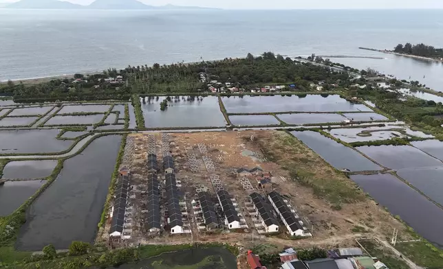 A housing complex is seen under construction near the waterfront area in Banda Aceh, Indonesia, Thursday, Dec. 12, 2024. (AP Photo/Achmad Ibrahim)