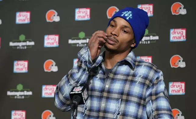 Cleveland Browns quarterback Dorian Thompson-Robinson reacts during a news conference after an NFL football game against the Miami Dolphins Sunday, Dec. 29, 2024, in Cleveland. (AP Photo/Sue Ogrocki)