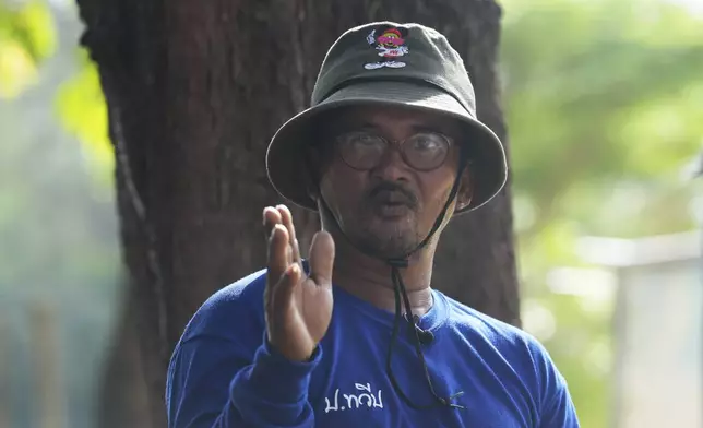 A survivor from tsunami Assistant of village chief Sanya Kongma, talks to the Associated Press reporters during an interview tsunami hit to Ban Nam khem, Takuapa district of Phang Nga province, southern Thailand, Monday, Dec. 9, 2024. (AP Photo/Sakchai Lalit)