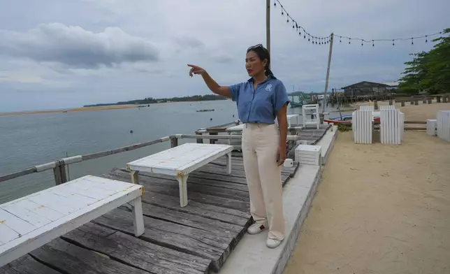 A survivor from tsunami Nuengduangjai Sritrakarn talks to the Associated Press reporters during an interview explain tsunami hit to Ban Nam khem, Takuapa district of Phang Nga province, southern Thailand, Monday, Dec. 9, 2024. (AP Photo/Sakchai Lalit)