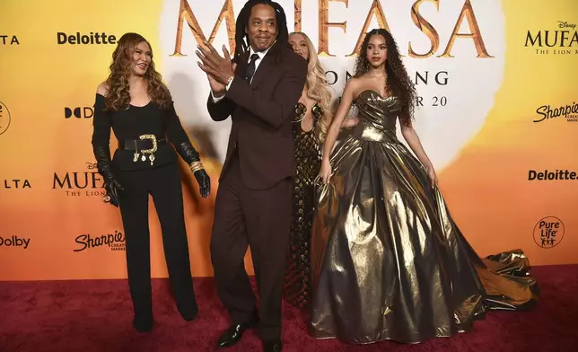 Tina Knowles, from left, Jay-Z, Beyonce, and Blue Ivy Carter arrive at the premiere of "Mufasa: The Lion King" on Monday, Dec. 9, 2024, at the Dolby Theatre in Los Angeles. (Photo by Richard Shotwell/Invision/AP)