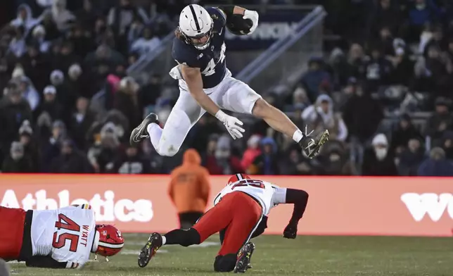 FILE - Penn State tight end Tyler Warren (44) hurdles Maryland defensive back Kevis Thomas (25) during the second quarter of an NCAA college football game, Saturday, Nov. 30, 2024, in State College, Pa. (AP Photo/Barry Reeger, File)