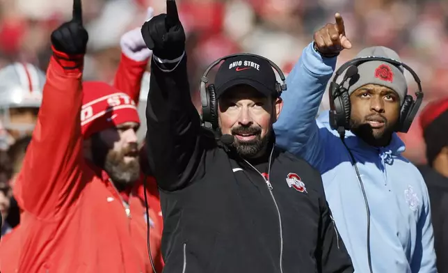 FILE - Ohio State head coach Ryan Day, center, instructs his team against Michigan during an NCAA college football game Saturday, Nov. 30, 2024, in Columbus, Ohio. (AP Photo/Jay LaPrete, File)