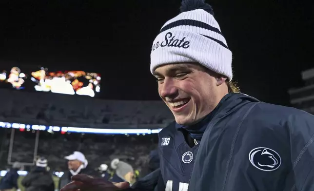 FILE - Penn State quarterback Drew Allar celebrates following a victory over Maryland in an NCAA college football game, Saturday, Nov. 30, 2024, in State College, Pa. (AP Photo/Barry Reeger, File)