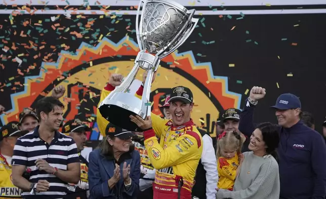 FILE - Joey Logano celebrates after winning a NASCAR Cup Series Championship auto race for the championship at Phoenix Raceway, Nov. 10, 2024, in Avondale, Ariz. (AP Photo/John Locher, File)