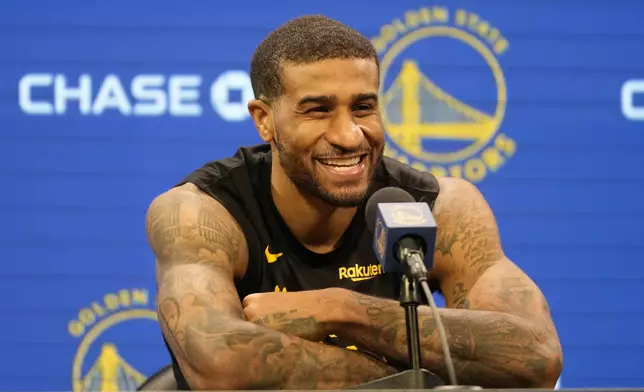 Golden State Warriors guard Gary Payton II speaks at a news conference at the NBA basketball team's facility in San Francisco, Tuesday, Dec. 17, 2024. (AP Photo/Jeff Chiu)