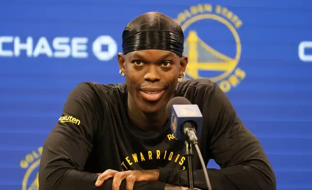 Golden State Warriors guard Dennis Schroder speaks at a news conference at the NBA basketball team's facility in San Francisco, Tuesday, Dec. 17, 2024. (AP Photo/Jeff Chiu)