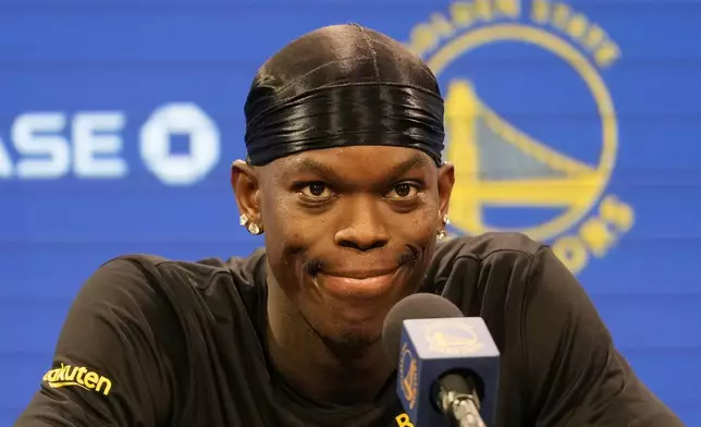 Golden State Warriors guard Dennis Schroder speaks at a news conference at the NBA basketball team's facility in San Francisco, Tuesday, Dec. 17, 2024. (AP Photo/Jeff Chiu)