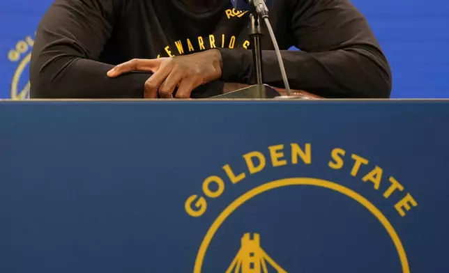 Golden State Warriors guard Dennis Schroder speaks at a news conference at the NBA basketball team's facility in San Francisco, Tuesday, Dec. 17, 2024. (AP Photo/Jeff Chiu)