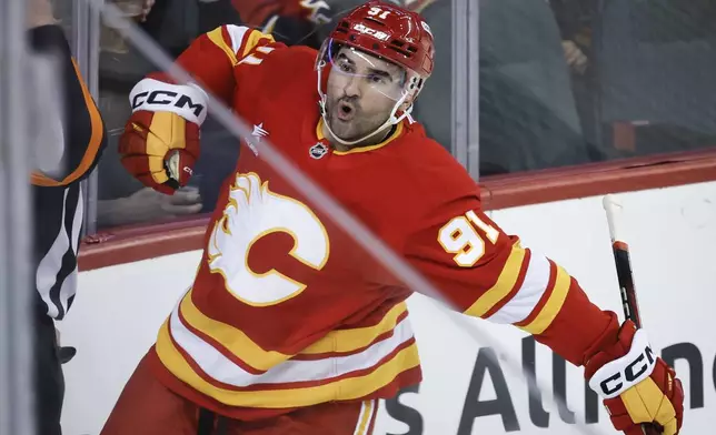 Calgary Flames' Nazem Kadri celebrates after his goal against the Florida Panthers during first-period NHL hockey game action in Calgary, Alberta, Saturday, Dec. 14, 2024. (Jeff McIntosh/The Canadian Press via AP)