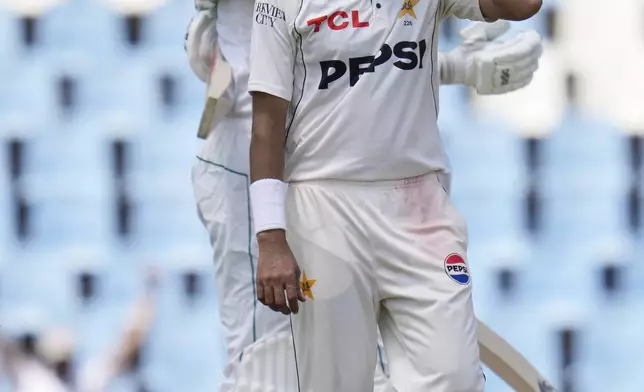 Pakistan's Mohammad Abbas, reacts as South Africa's Marco Jansen, back, celebrates teammate Kagiso Rabada, after scoring the winning runs following the day four of the Test cricket match between South Africa and Pakistan, at the Centurion Park in Centurion, South Africa, Sunday, Dec. 29, 2024. (AP Photo/Themba Hadebe)