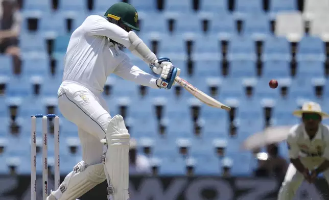 South Africa's Kagiso Rabada plays a shot during day four of the Test cricket match between South Africa and Pakistan, at the Centurion Park in Centurion, South Africa, Sunday, Dec. 29, 2024. (AP Photo/Themba Hadebe)