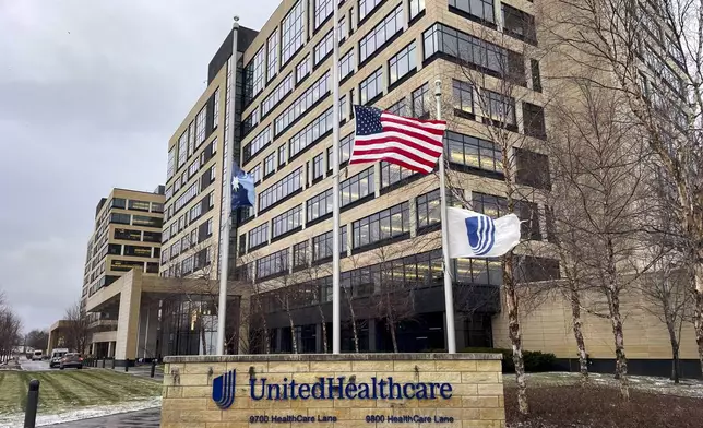 The UnitedHealthcare headquarters in Minnetonka, Minn., lowered its flags to half-staff on Wednesday, Dec. 4, 2024, in honor of CEO Brian Thompson, who was fatally shot outside a hotel in New York. (Kerem Yücel/Minnesota Public Radio via AP)