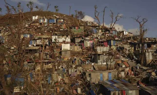 Damage is seen in the Kaweni slum, on the outskirts of Mamoudzou, in the French Indian Ocean island of Mayotte, Dec. 19, 2024, in the aftermath of Cyclone Chido. (AP Photo/Adrienne Surprenant)