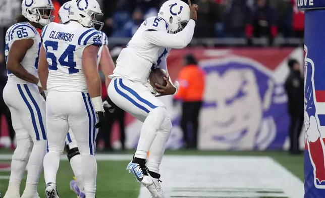 Indianapolis Colts quarterback Anthony Richardson (5) celebrates after his two-point conversion during the second half of an NFL football game against the New England Patriots, Sunday, Dec. 1, 2024, in Foxborough, Mass. (AP Photo/Charles Krupa)