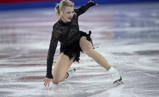 Amber Glenn, of the United States, competes in the women's short program segment at the ISU Grand Prix Finals of Figure Skating, Thursday, Dec. 5, 2024, in Grenoble, France. (AP Photo/Laurent Cipriani)