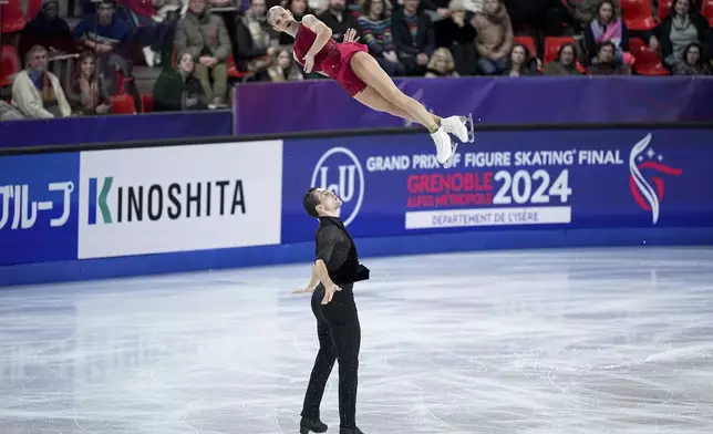 Minerva Fabienne Hase and Nikita Volodin, of Germany, compete in the pairs' short program segment at the ISU Grand Prix Finals of Figure Skating, Thursday, Dec. 5, 2024, in Grenoble, France. (AP Photo/Laurent Cipriani)