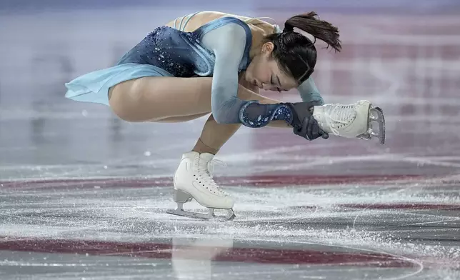 Hana Yoshida, of Japan, competes in the women's short program segment at the ISU Grand Prix Finals of Figure Skating, Thursday, Dec. 5, 2024, in Grenoble, France. (AP Photo/Laurent Cipriani)