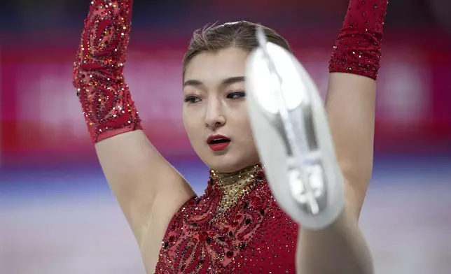 Kaori Sakamoto, of Japan, competes in the women's short program segment at the ISU Grand Prix Finals of Figure Skating, Thursday, Dec. 5, 2024, in Grenoble, France. (AP Photo/Laurent Cipriani)