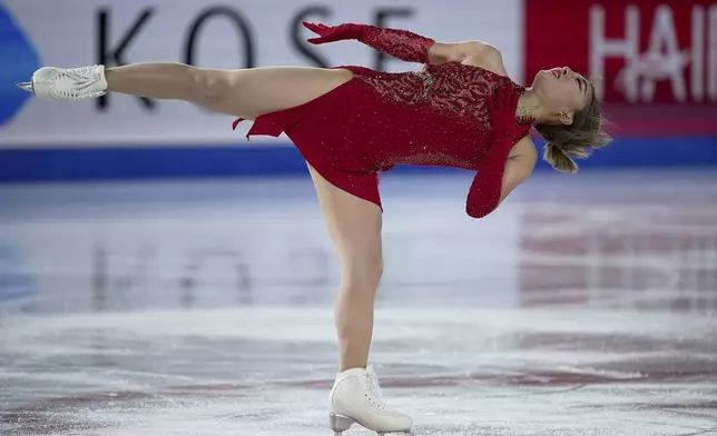 Kaori Sakamoto, of Japan, competes in the women's short program segment at the ISU Grand Prix Finals of Figure Skating, Thursday, Dec. 5, 2024, in Grenoble, France. (AP Photo/Laurent Cipriani)