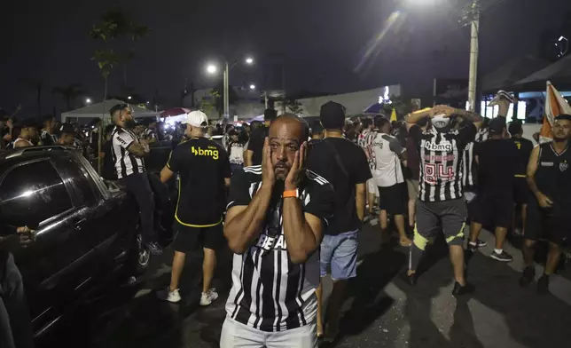 Brazil's Atletico Mineiro soccer fan reacts after their team lost the the Copa Libertadores title match to Brazil's Botafogo, in Belo Horizonte, Brazil, Saturday, Nov. 30, 2024. Brazil's Botafogo won 3-1. (AP Photo/Thomas Santos)