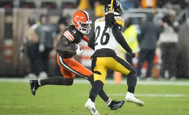 Cleveland Browns wide receiver Jerry Jeudy (3) carries against Pittsburgh Steelers cornerback Donte Jackson (26) in the first half of an NFL football game, Thursday, Nov. 21, 2024, in Cleveland. (AP Photo/Sue Ogrocki)