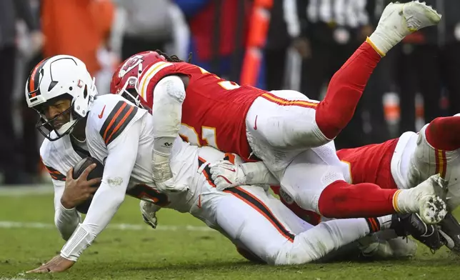 Kansas City Chiefs linebacker Nick Bolton (32) sacks Cleveland Browns quarterback Jameis Winston (5) during the second half of an NFL football game, Sunday, Dec. 15, 2024, in Cleveland. (AP Photo/David Richard)