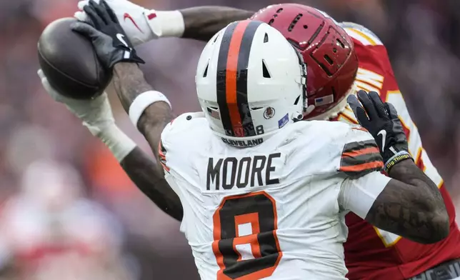 Kansas City Chiefs safety Nazeeh Johnson (13) breaks up a pass intended for Cleveland Browns wide receiver Elijah Moore (8) during the first half of an NFL football game, Sunday, Dec. 15, 2024, in Cleveland. (AP Photo/Sue Ogrocki)