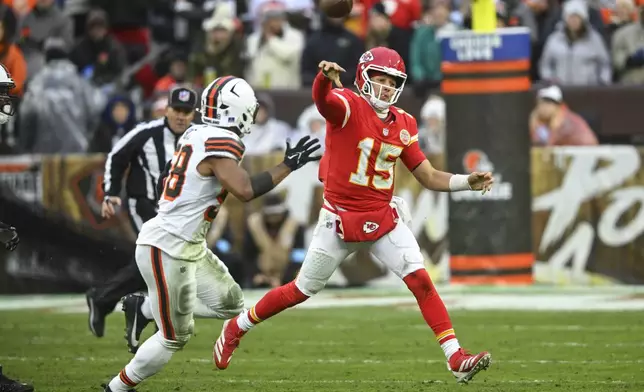 Kansas City Chiefs quarterback Patrick Mahomes (15) passes against the Cleveland Browns during the second half of an NFL football game, Sunday, Dec. 15, 2024, in Cleveland. (AP Photo/David Richard)