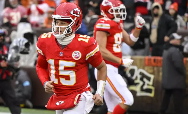 Kansas City Chiefs quarterback Patrick Mahomes (15) celebrates a touchdown against the Cleveland Browns during the first half of an NFL football game, Sunday, Dec. 15, 2024, in Cleveland. (AP Photo/David Richard)