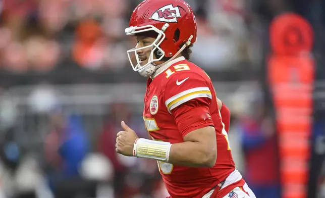 Kansas City Chiefs quarterback Patrick Mahomes (15) celebrates a touchdown against the Cleveland Browns during the second half of an NFL football game, Sunday, Dec. 15, 2024, in Cleveland. (AP Photo/David Richard)