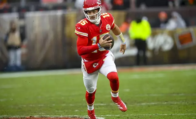 Kansas City Chiefs quarterback Patrick Mahomes (15) runs against the Cleveland Browns during the first half of an NFL football game, Sunday, Dec. 15, 2024, in Cleveland. (AP Photo/David Richard)