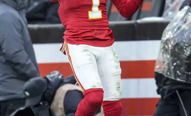 Kansas City Chiefs wide receiver Xavier Worthy (1) celebrates his touchdown against the Cleveland Browns during the second half of an NFL football game, Sunday, Dec. 15, 2024, in Cleveland. (AP Photo/Sue Ogrocki)