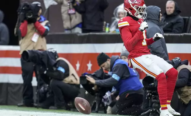 Kansas City Chiefs wide receiver Xavier Worthy (1) celebrates his touchdown against the Cleveland Browns during the second half of an NFL football game, Sunday, Dec. 15, 2024, in Cleveland. (AP Photo/Sue Ogrocki)