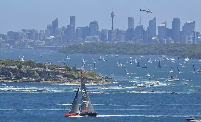 Master Lock Comanche sails out of the heads soon after the start of the Sydney to Hobart yacht race in Sydney Harbour, Thursday, Dec. 26, 2024. (Mick Tsikas/AAP Image via AP).