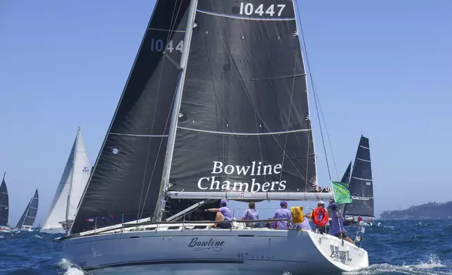 Bowline sails out of the heads following the start of the Sydney to Hobart yacht race in Sydney, Thursday, Dec. 26, 2024. (Paul Bramble/Rolex via AP)