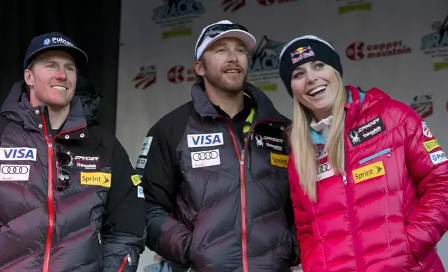 FILE - Ted Ligety, left, Bode Miller, Lindsey Vonn stand together at a U.S. Ski Team event at Copper Mountain, Colo., on Friday, Nov. 8, 2013. (AP Photo/Nathan Bilow, File)