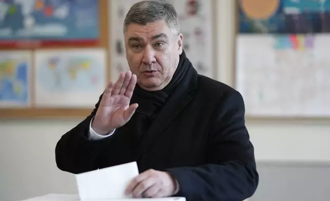 Croatia's President Zoran Milanovic casts his ballot during presidential elections, at a polling station in Zagreb, Croatia, Sunday, Dec. 29, 2024. (AP Photo/Darko Bandic)