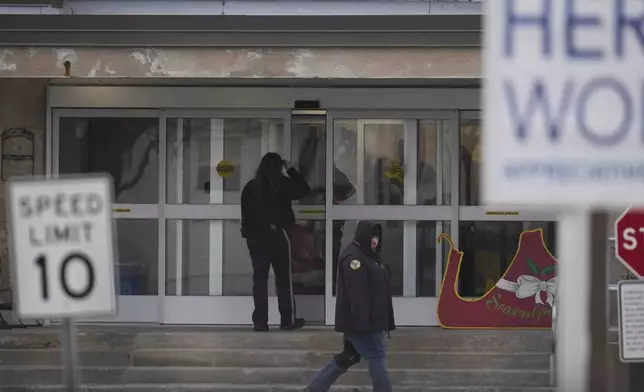 CORRECTS DATE TO WEDNESDAY, DEC. 18, 2024 - People enter Indiana State Prison where, barring last-minute court action or intervention by Gov. Eric Holcomb, Joseph Corcoran, 49, convicted in the 1997 killings of his brother and three other people, is scheduled to be put to death by lethal injection before sunrise Wednesday, Dec. 18, 2024, in Michigan City, Ind. (AP Photo/Erin Hooley)