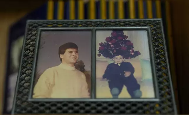 An old picture of Suheil Hamwi, left, who spent 32 years in prison in Syria and returned to Lebanon after the government of Bashar Assad was toppled, sits on a table inside of his home at the northern coastal town of Chekka, Lebanon, Tuesday, Dec. 10, 2024. (AP Photo/Hassan Ammar)