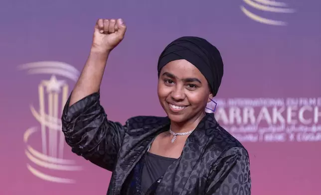 Sudanese actress Shajan Suliman gestures while attending the screening of Sudan Remember Us movie, during the Marrakech International Film Festival, in Morocco, Monday, Dec. 2, 2024. (AP Photo/Mosa'ab Elshamy)
