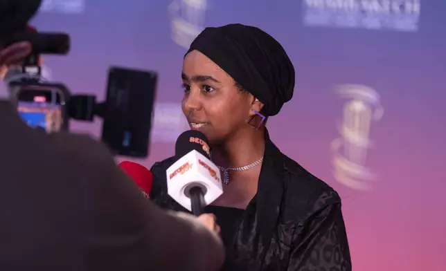 Sudanese actress Shajan Suliman speaks to the press before attending the screening of Sudan, Remember Us movie during the Marrakech International Film Festival, in Morocco, Monday, Dec. 2, 2024. (AP Photo/Mosa'ab Elshamy)