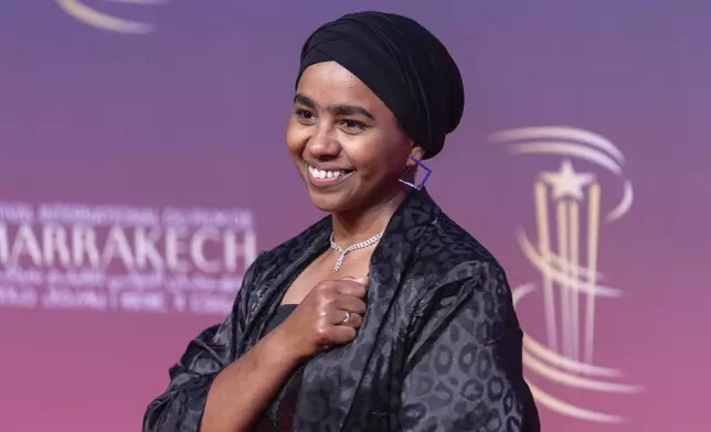 Sudanese actress Shajan Suliman gestures while attending the screening of Sudan Remember Us movie, during the Marrakech International Film Festival in Morocco, Monday, Dec. 2, 2024. (AP Photo/Mosa'ab Elshamy)