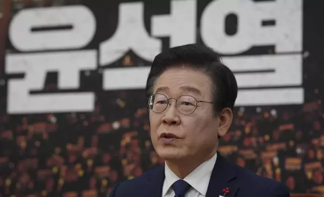 South Korea's main opposition Democratic Party leader Lee Jae-myung, speaks during an interview with The Associated Press at the National Assembly in Seoul, South Korea, Friday, Dec. 6, 2024. The letters read "Yoon Suk Yeol." (AP Photo/Lee Jin-man)